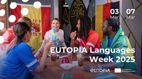 Five young people of diverse ethnic backgrounds are sitting happily at a table in a café or restaurant. They are wearing colorful jerseys or flags representing different countries. Small national flags, drinks, and snacks are on the table. In the backgrou